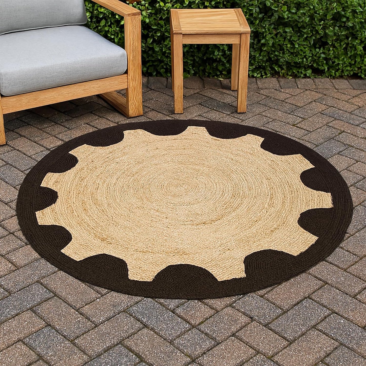 Round jute rug with black border on a patio with outdoor furniture.