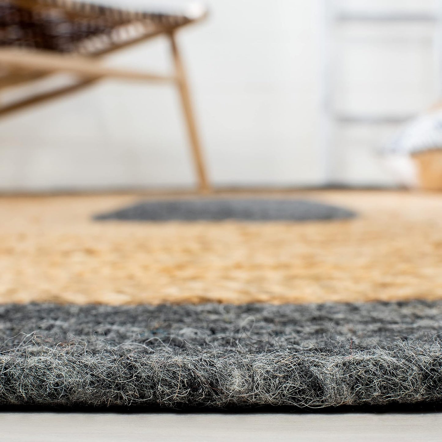 Handwoven jute rug with gray and natural hues, perfect for adding texture to any space.