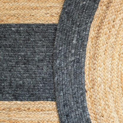 Round braided jute rug with gray wool accents, natural fibers, stylish home decor.