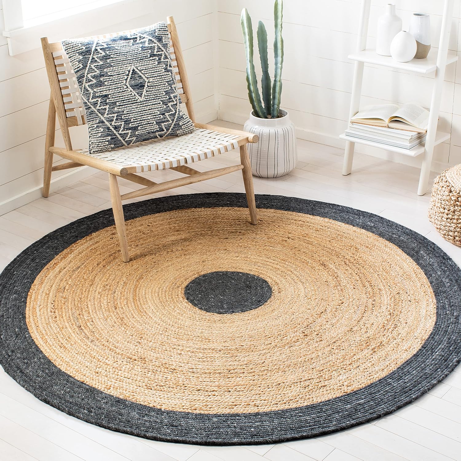 Round jute rug with black and natural tones, ideal for bohemian home decor.
