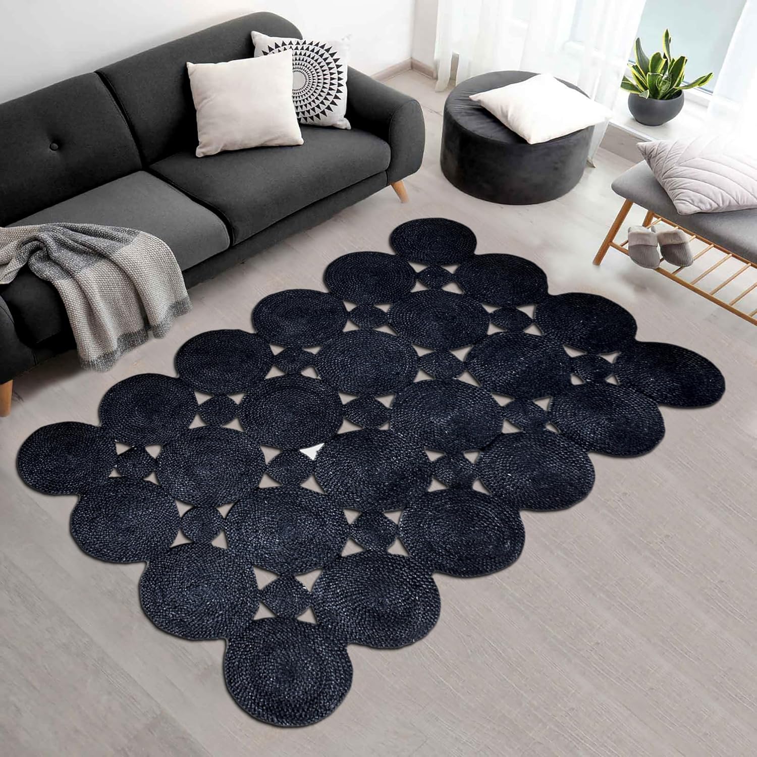 Navy blue round woven rug with geometric pattern, perfect for living room decor.