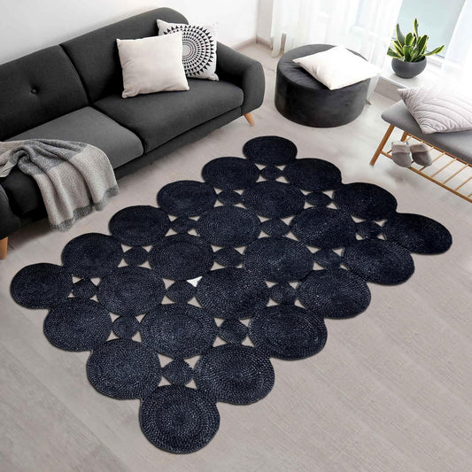 Navy blue round woven rug with geometric pattern, perfect for living room decor.