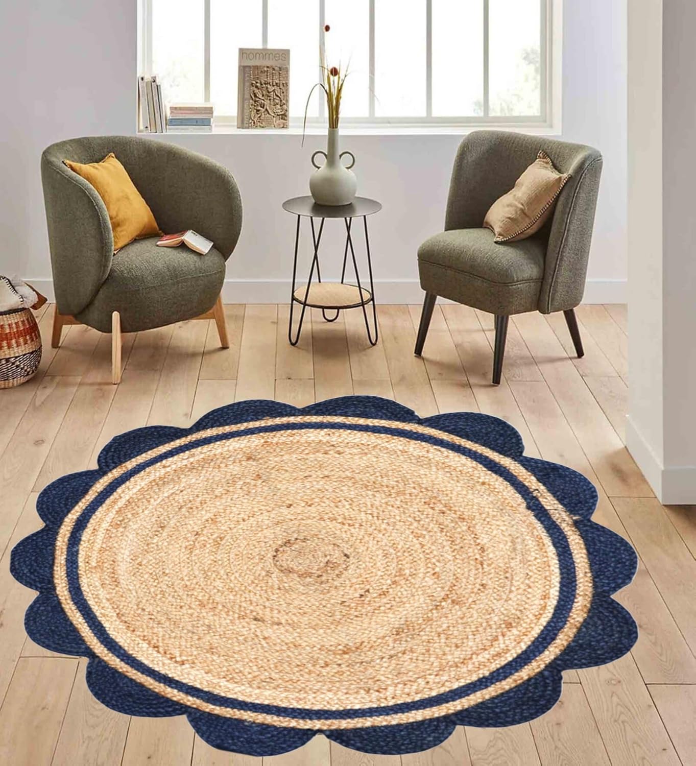 Round jute rug with blue border on wooden floor in living room