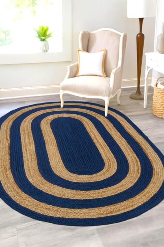 Navy and tan braided oval area rug, eco-friendly jute material, perfect for enhancing living spaces.