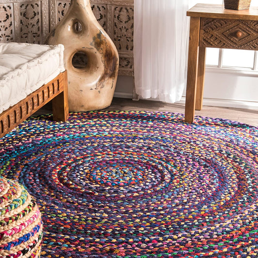 Multicolored braided rug in a room with wooden furniture and decorative elements.