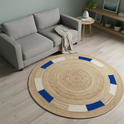 Round jute area rug with blue and white accents, perfect for adding a natural touch to your living space.