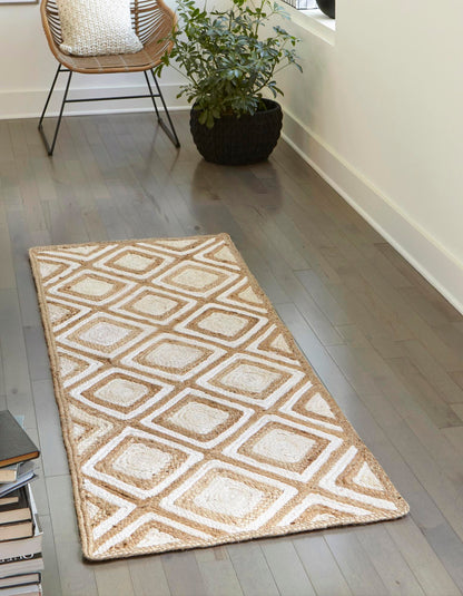Beige patterned rug on a wooden floor with a chair and plant in the background