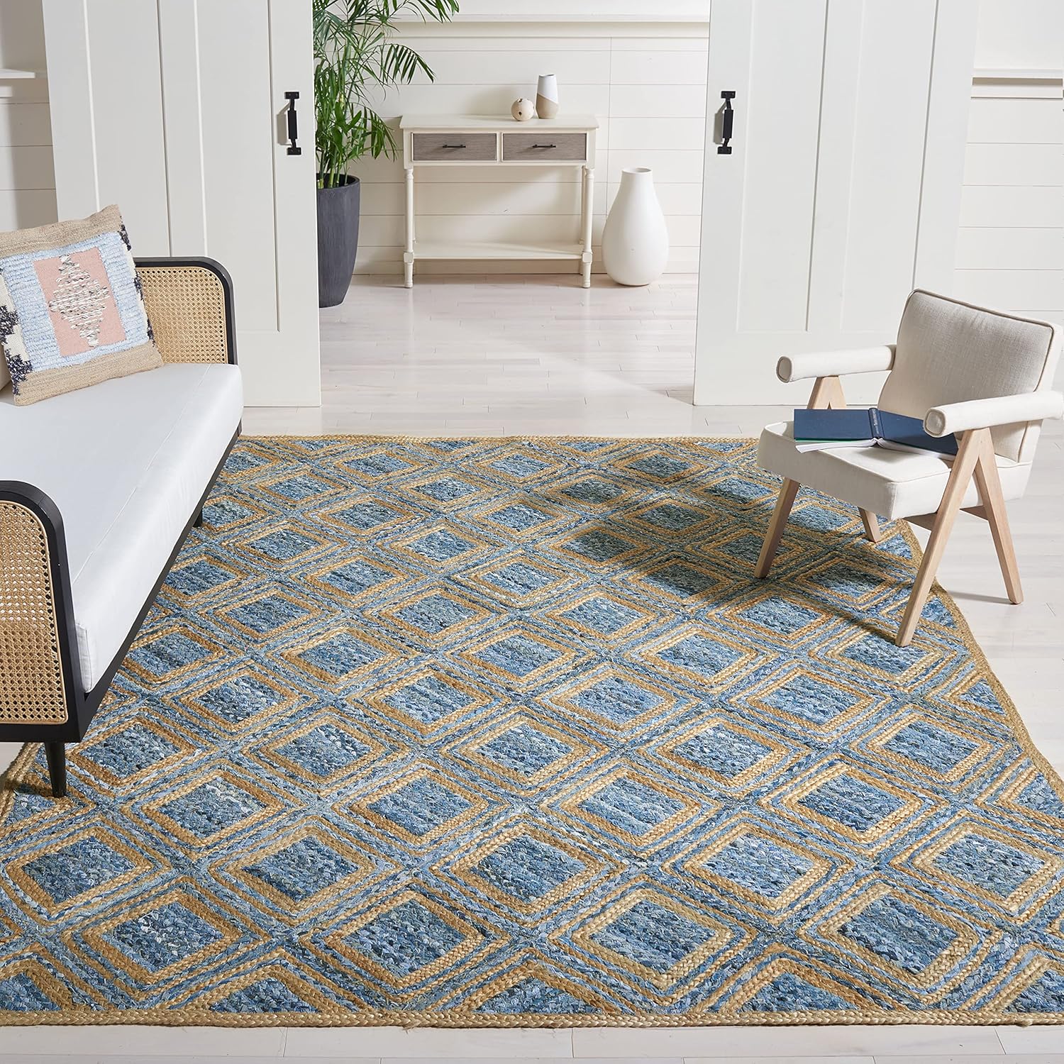Geometric blue and gold area rug, made of durable woven material, perfect for modern living spaces.