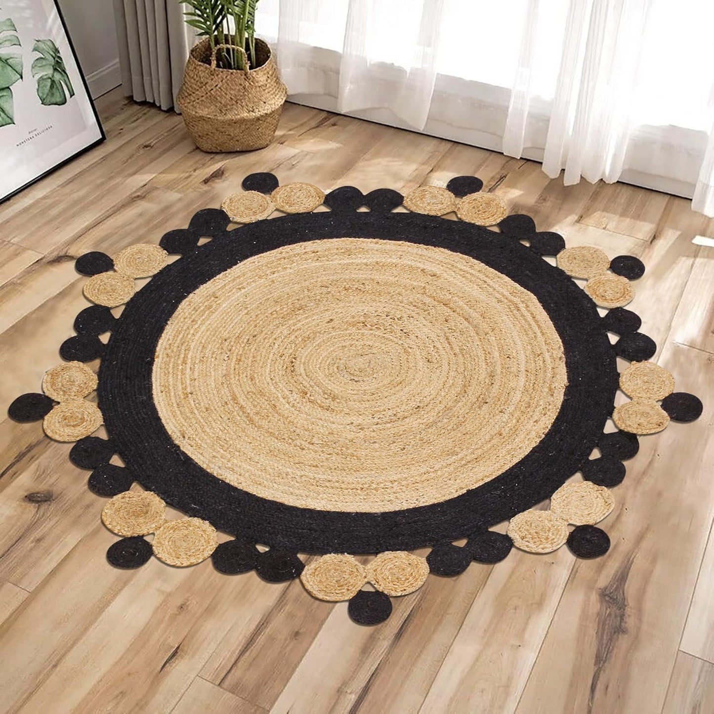 Round jute area rug with black and natural tones, featuring a decorative pom-pom edge.
