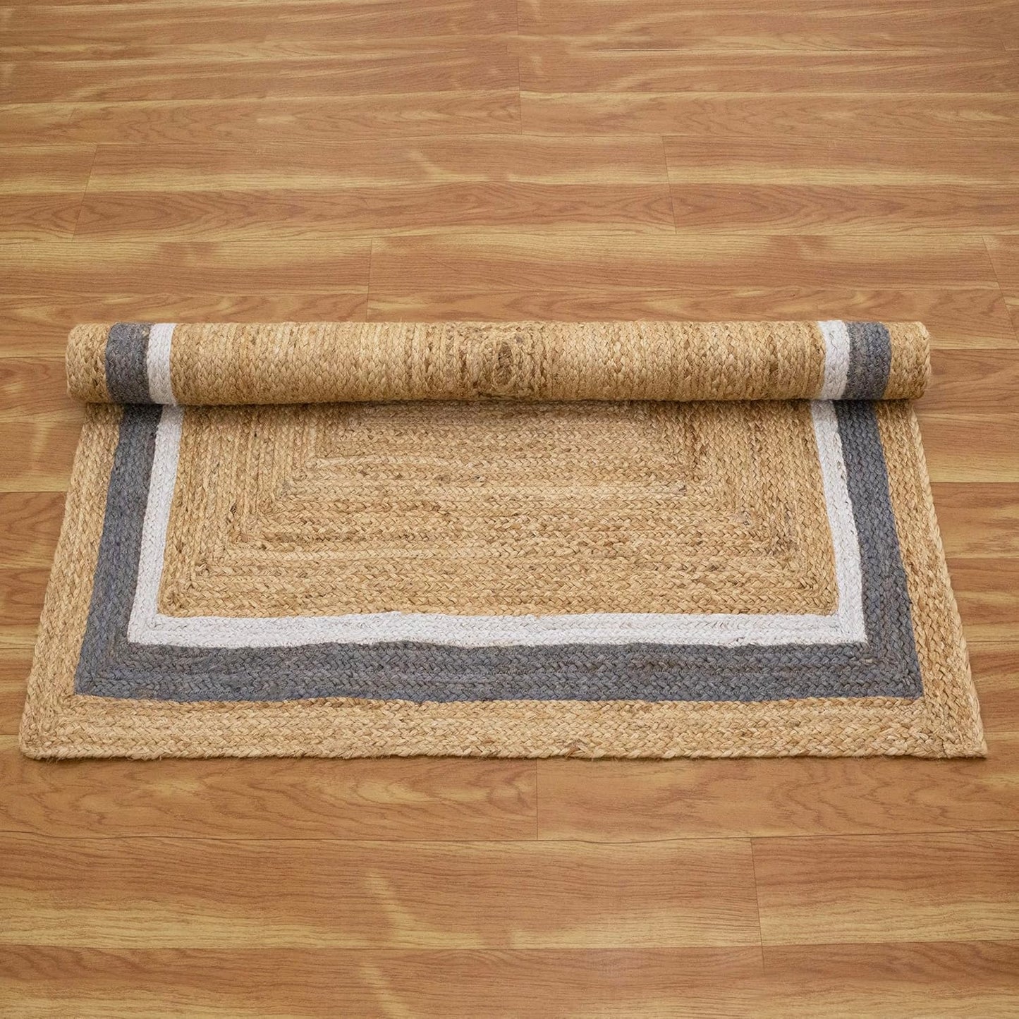 Natural Jute Area Rug with a textured finish and a stylish gray border, perfect for enhancing any living space.