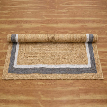 Natural Jute Area Rug with a textured finish and a stylish gray border, perfect for enhancing any living space.