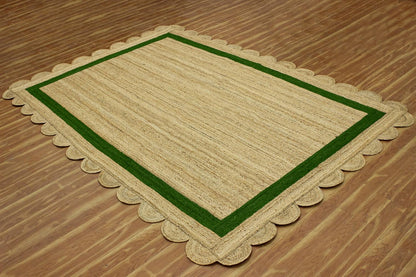 Natural Jute Area Rug with scalloped edges and a green border, perfect for enhancing indoor spaces.