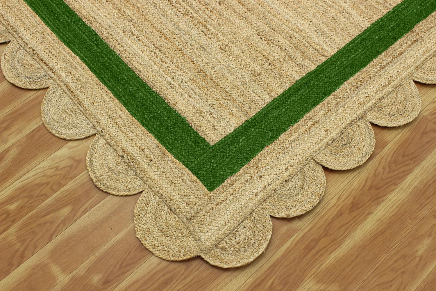 Natural Jute Area Rug with scalloped edges and a green border, perfect for adding texture to any room.