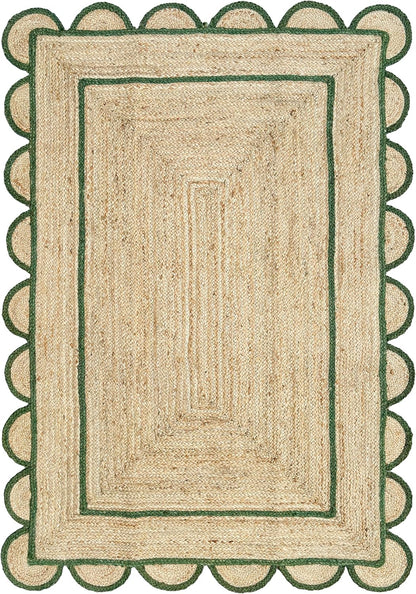 A rectangular natural jute rug with a scalloped green border and concentric green inner borders, shown flat against a white background.
