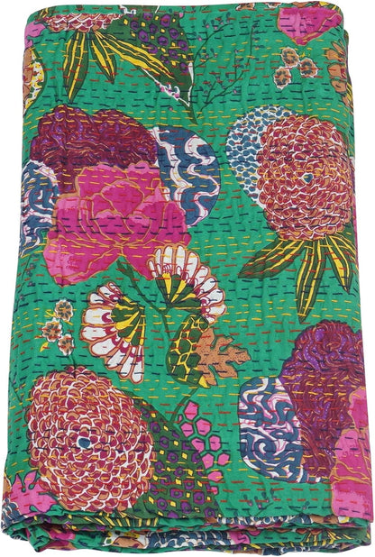 Colorful floral patterned fabric with vibrant colors on a green background