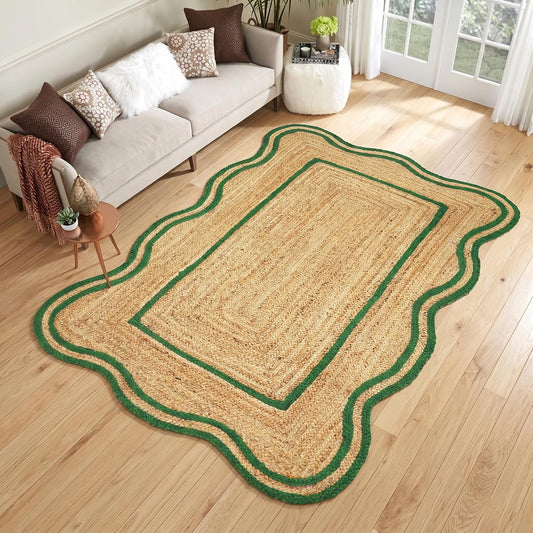 Natural Jute Area Rug with a scalloped green border in a cozy living room setting on wooden flooring.