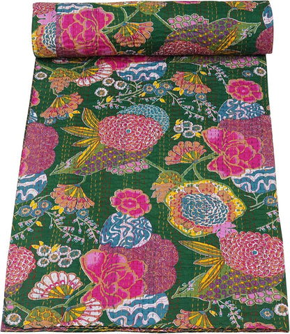 Colorful floral-patterned fabric roll on a green background