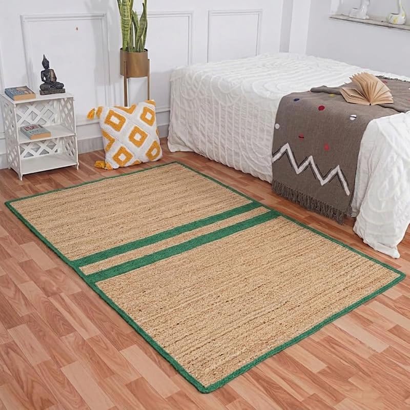 Natural Jute Area Rug beige jute floor carpet with green border, laid under bed in living room