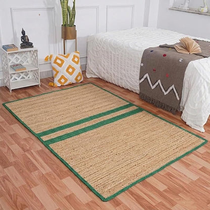 Natural Jute Area Rug beige jute floor carpet with green border, laid under bed in living room