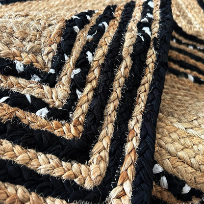 Natural Jute Area Rug with a textured black and tan pattern — perfect as a stylish floor carpet in any space.
