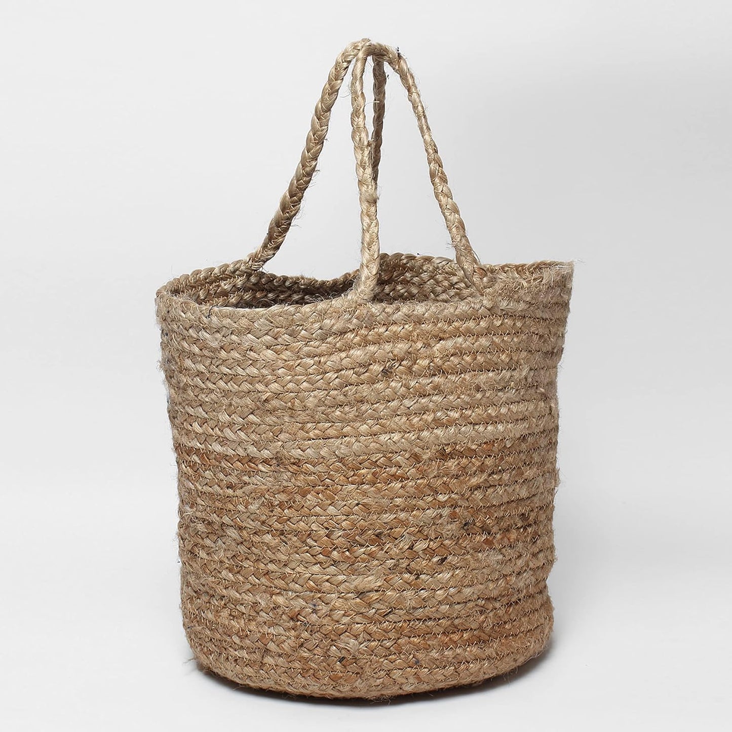 Natural woven jute basket designed as a plant pot cover and decorative storage basket for living room, bedroom, and balcony decor.