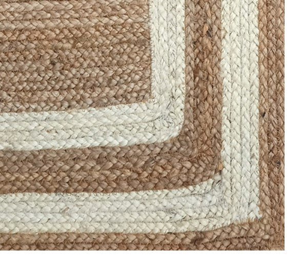 Close-up of a braided rug with brown and beige pattern
