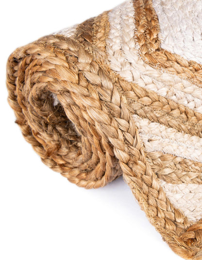 Rolled jute rug with natural and beige colors on a white background