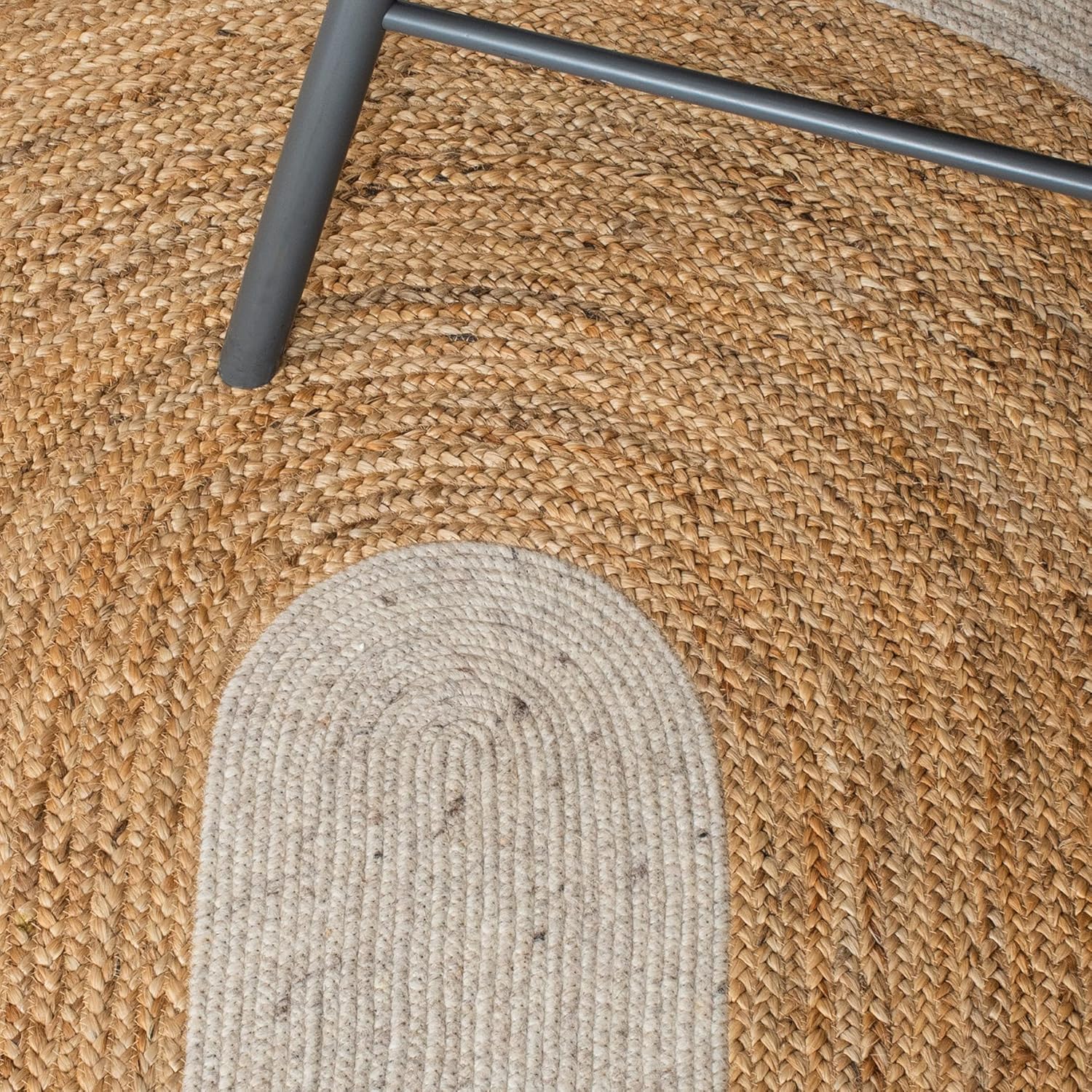 Natural jute and wool area rug, round shape, featuring beige and tan tones, perfect for cozy home decor.