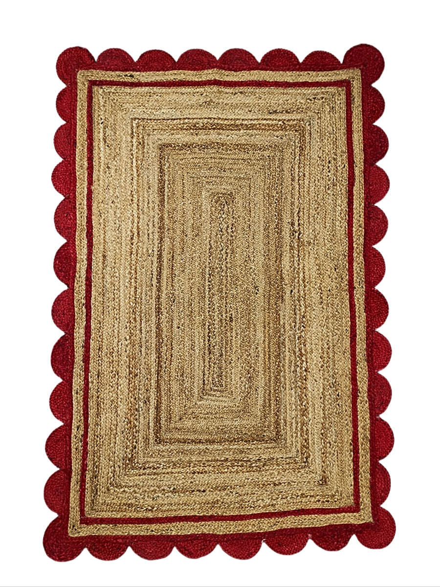 Rectangular rug with red border on a white background