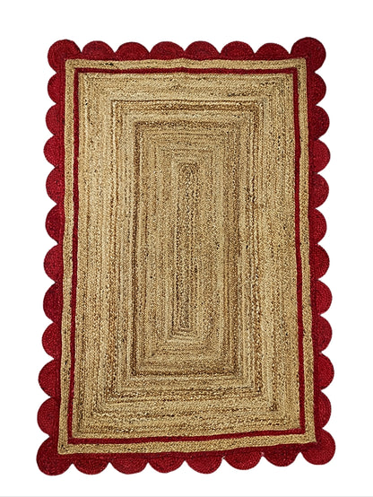 Rectangular rug with red border on a white background