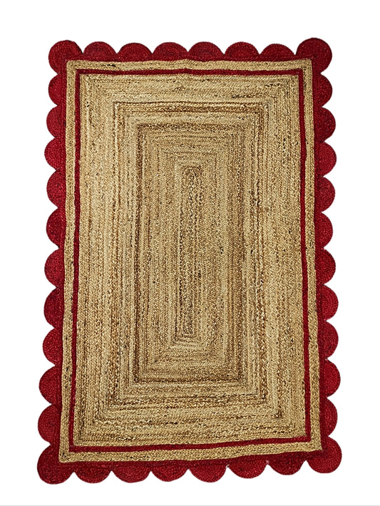 Rectangular rug with red border on a white background