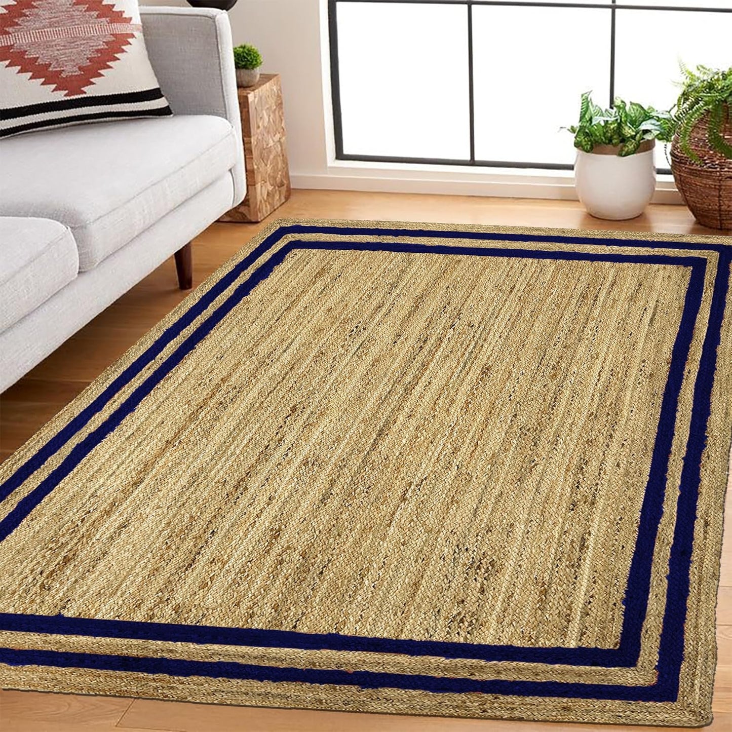 Natural Jute Area Rug with navy border, ideal for living room or entryway as a stylish floor carpet.