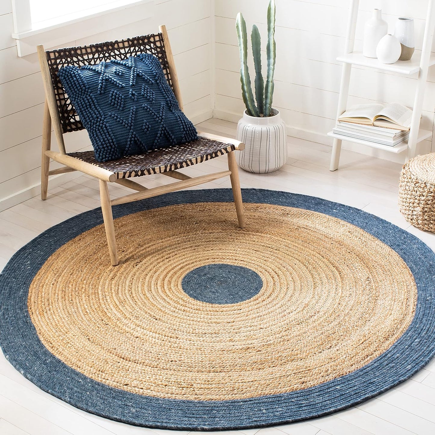 Natural jute rug with navy border, round shape, perfect for modern home decor.