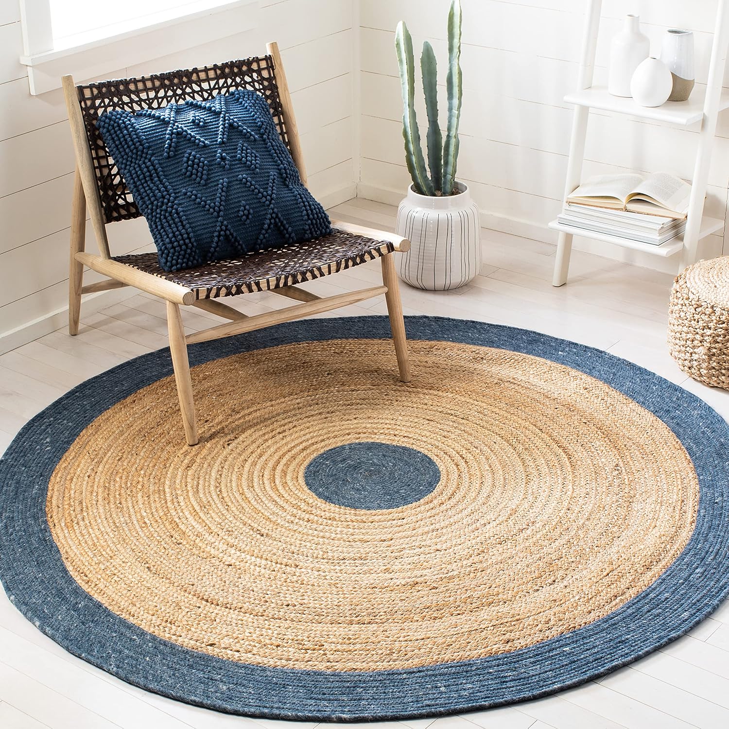 Natural jute rug with navy border, round shape, perfect for modern home decor.
