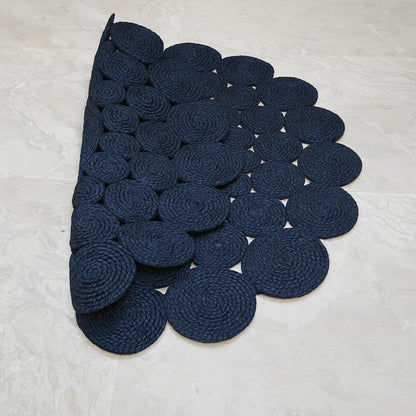 Natural Jute Area Rug featuring a scalloped design in deep navy, perfect for enhancing any entryway or living space.