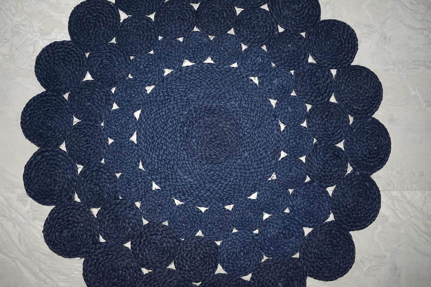 Natural Jute Area Rug in a circular design with textured woven patterns, perfect for enhancing any room's decor.
