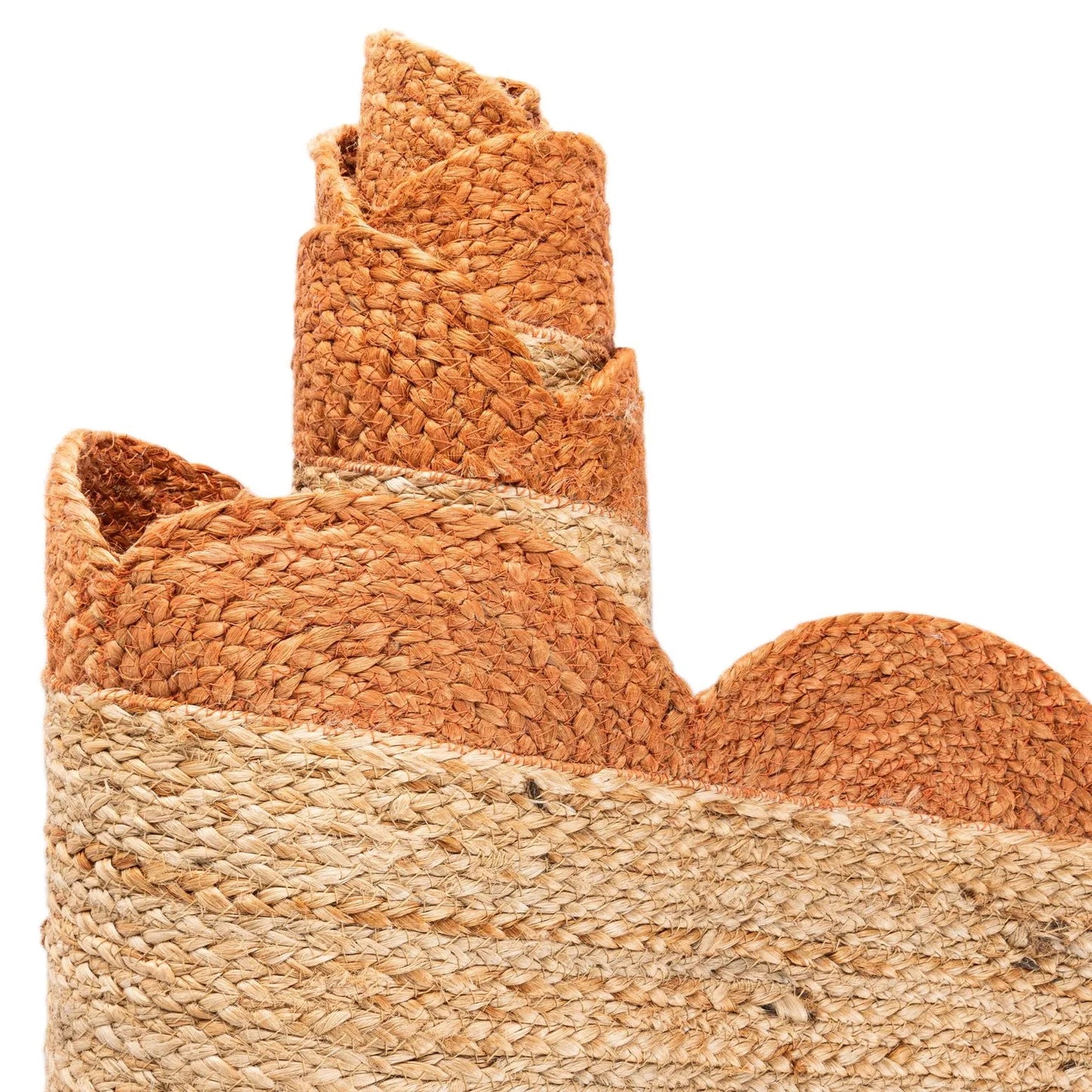 Woven basket with a rolled piece of fabric on a white background