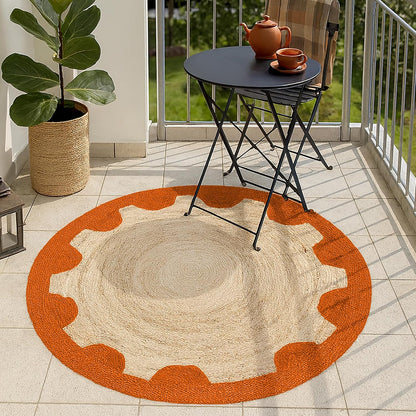 Natural Jute Area Rug with a scalloped orange border, perfect for indoor or outdoor spaces.
