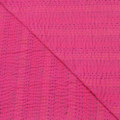 Close-up of pink fabric with a subtle pattern
