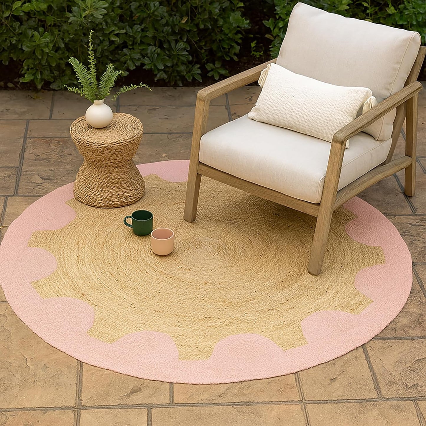 Natural Jute Area Rug in round shape with scalloped pink border, perfect for indoor or outdoor use.