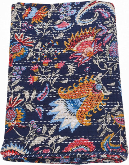 Colorful embroidered fabric with floral and animal patterns on a blue background