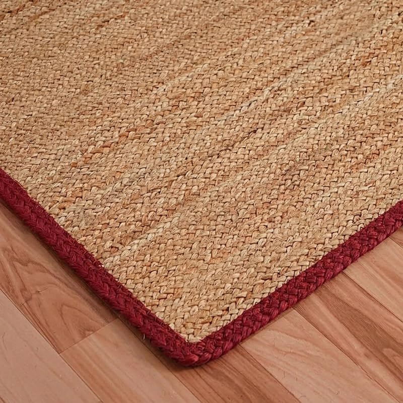 Natural Jute Area Rug floor carpet in natural jute with red border along a square corner