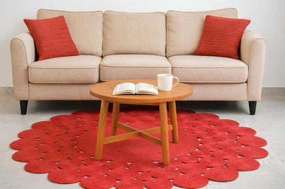 Natural Jute Area Rug in a round shape, featuring a scalloped design that complements a cozy living room setting.