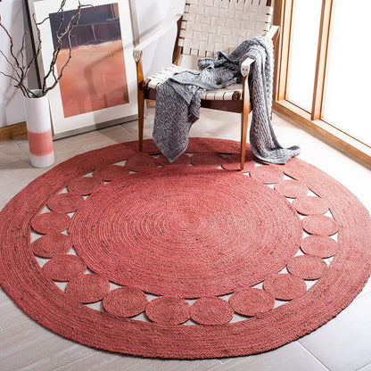 Round red woven area rug with circular cutouts, ideal for home decor and cozy living spaces.