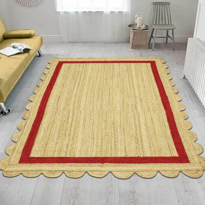 Natural Jute Area Rug with a scalloped edge and red border, enhancing the cozy atmosphere of any living space.