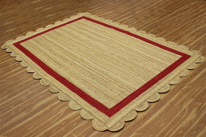 Natural Jute Area Rug with scalloped edges in earthy tones — perfect for adding texture to any living space.