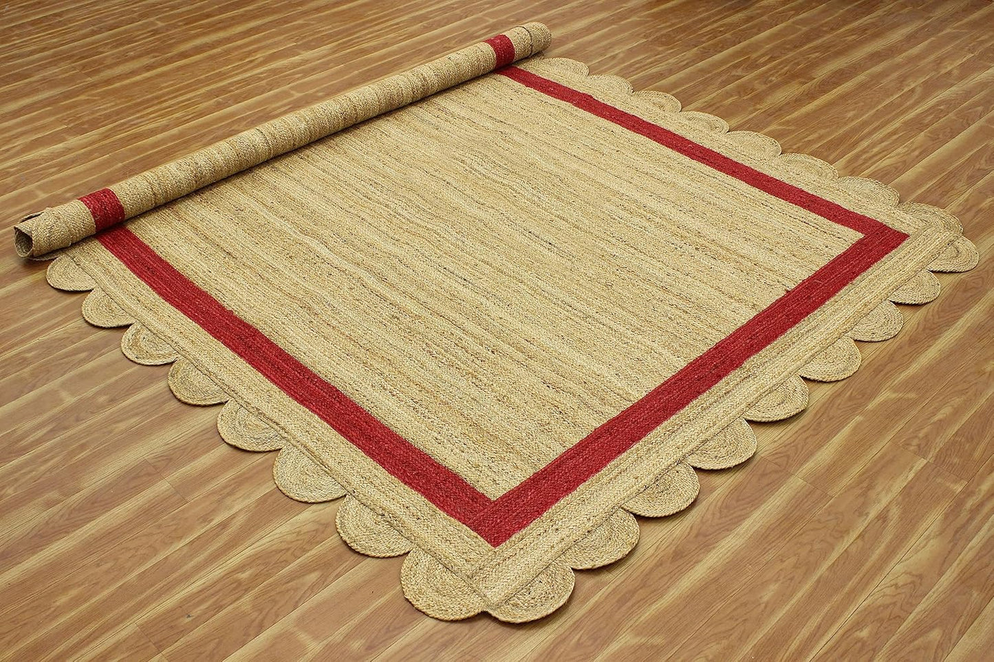 Natural Jute Area Rug with a scalloped edge and red border, enhancing any living space with its earthy texture.