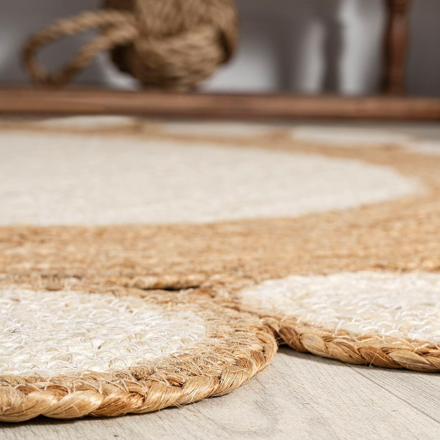 Natural Jute Area Rug with a textured finish, featuring a bohemian design that adds warmth to any living space.