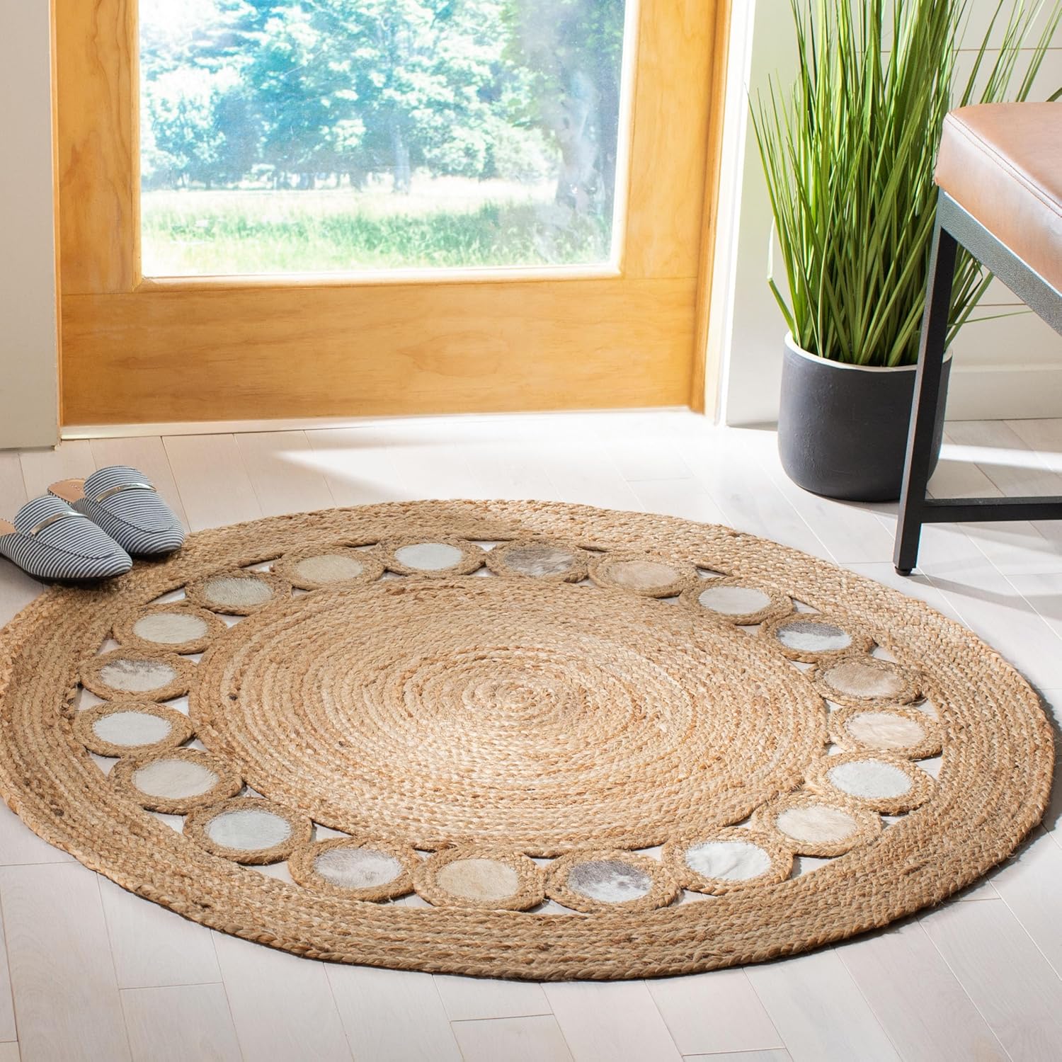 Natural Jute Area Rug with a textured round design featuring smooth stone accents, perfect for enhancing any entryway decor.
