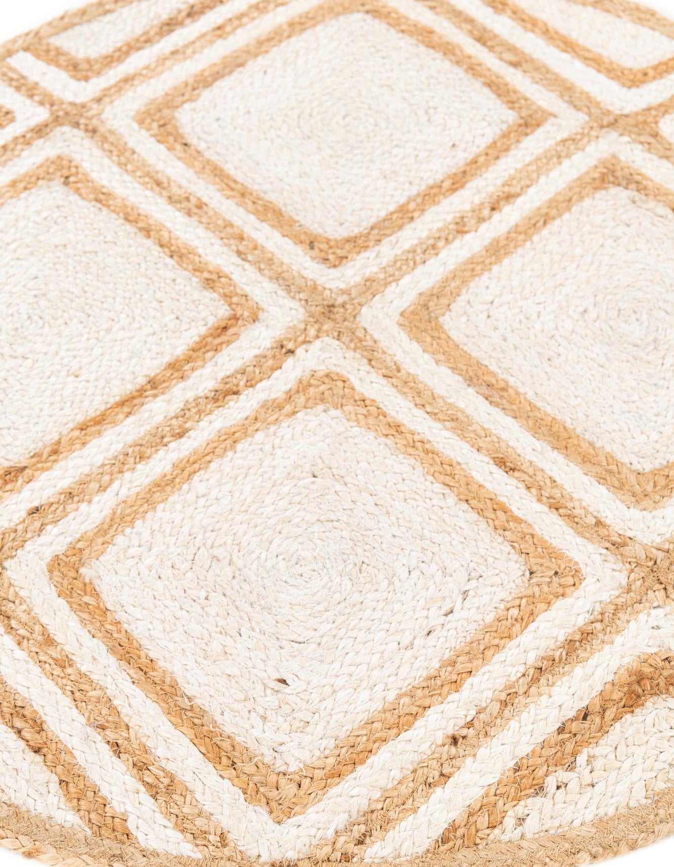 Close-up of a beige and white geometric patterned rug